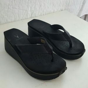 Volatile black wedge flip flop 7